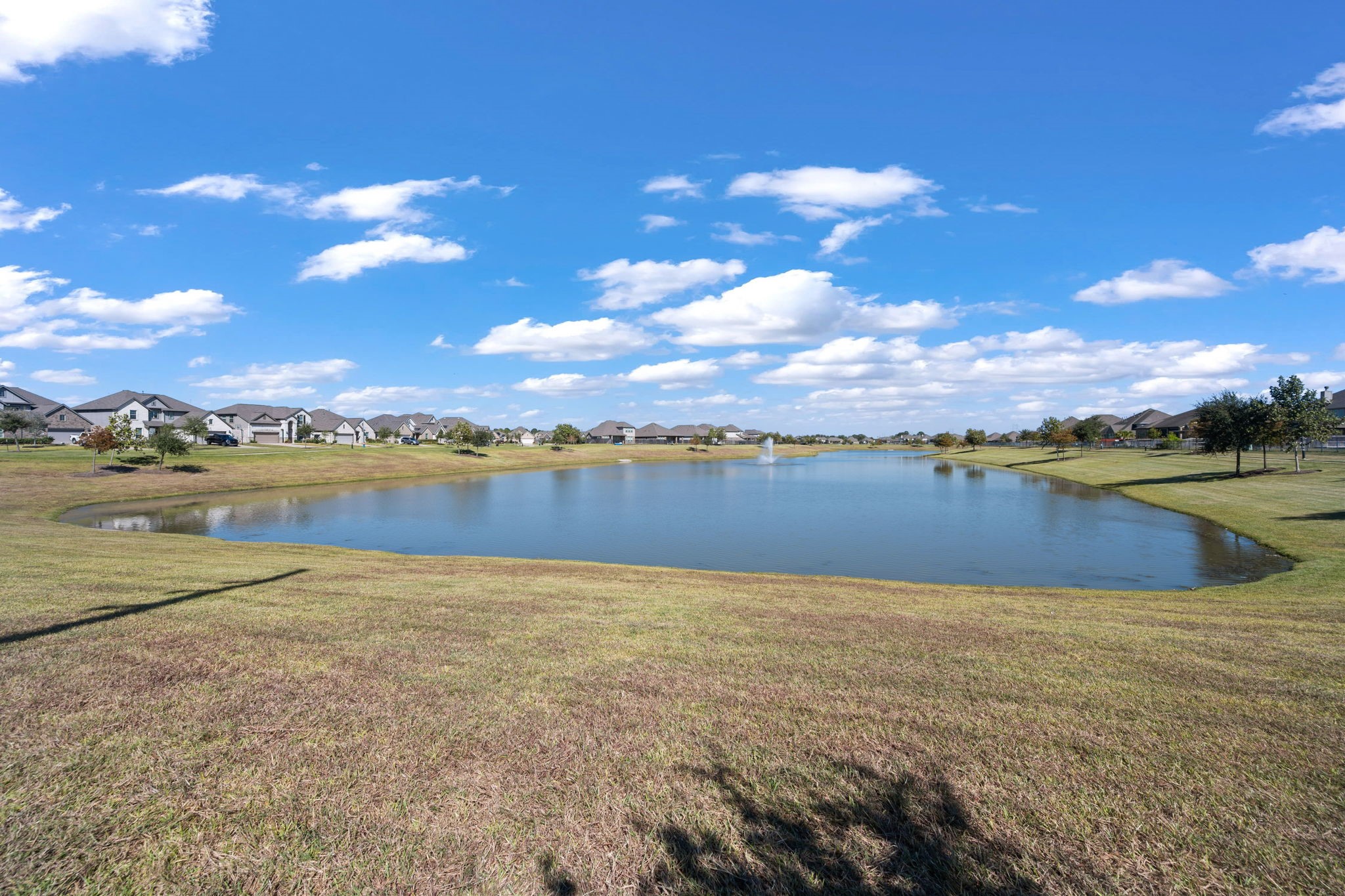 4218 Redford Valley Road Rosharon, TX 77583 - Photo 34 of 36 a view of a lake with houses in the back