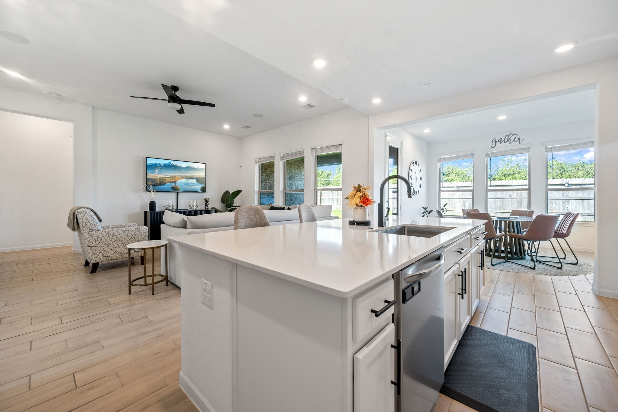 4218 Redford Valley Road Rosharon, TX 77583 - Photo 9 of 36 a kitchen with granite countertop a sink a counter space dining table and chairs