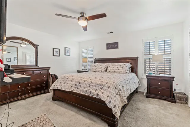 a bedroom with a bed and a dresser