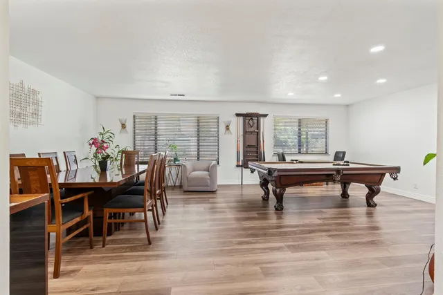 a living room with furniture a table and a potted plant