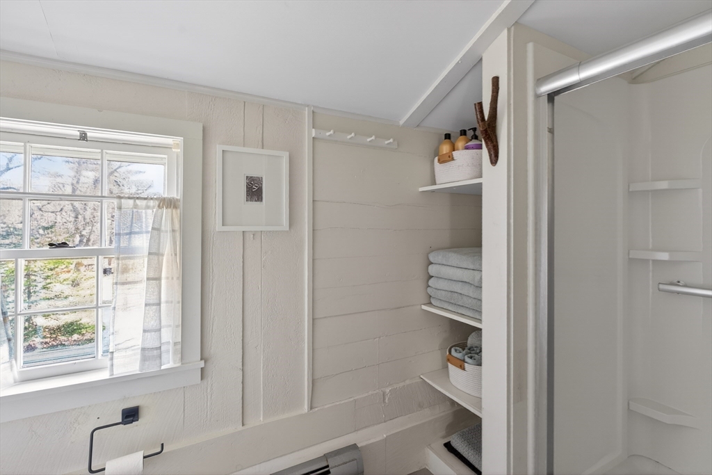 7 Pip'n Road Edgartown, MA 02539 - Photo 18 of 41 a bathroom with a bathtub and a shower