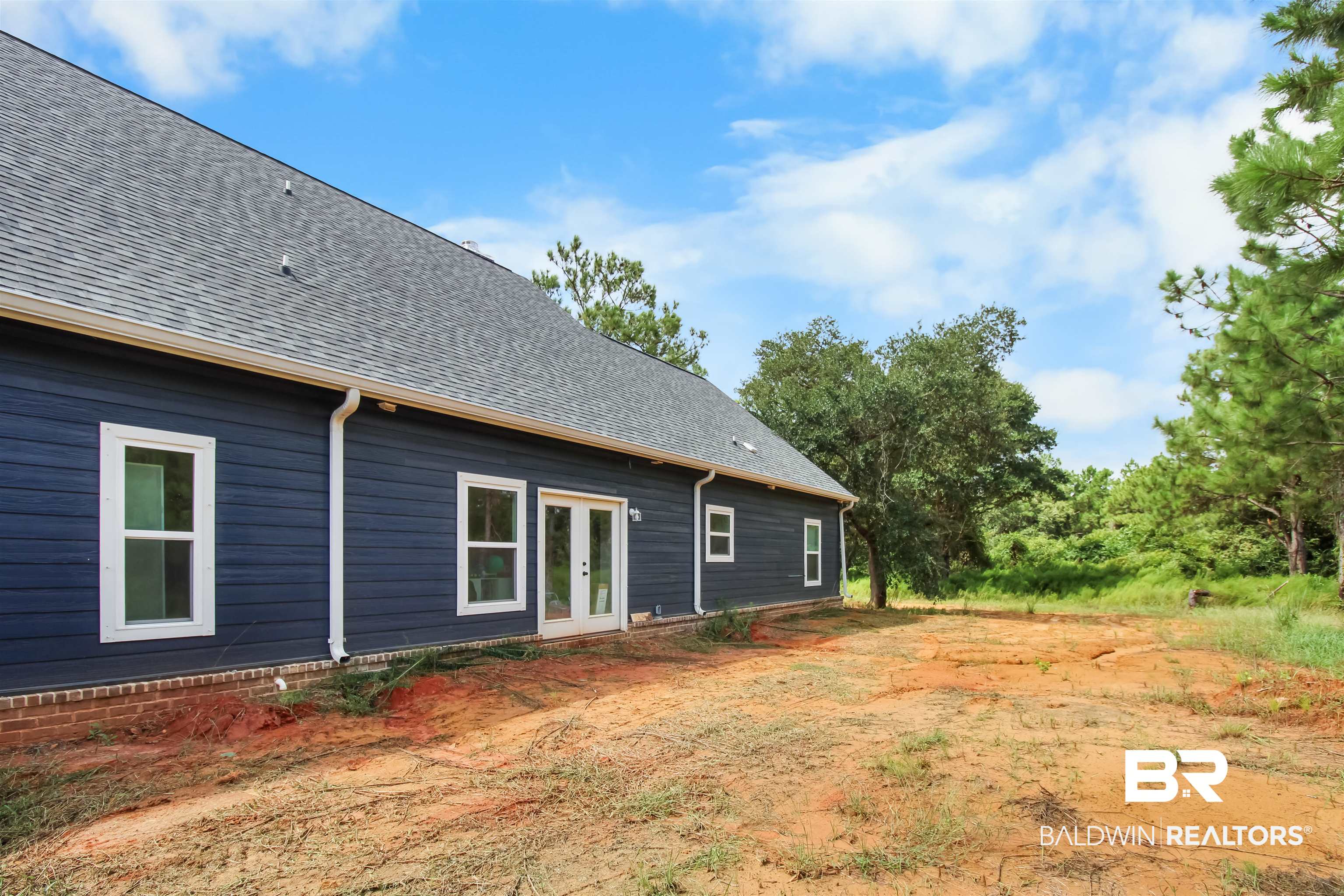 26197 Eagle Trace Elberta, AL 36530 - Photo 25 of 26 View of yard featuring french doors