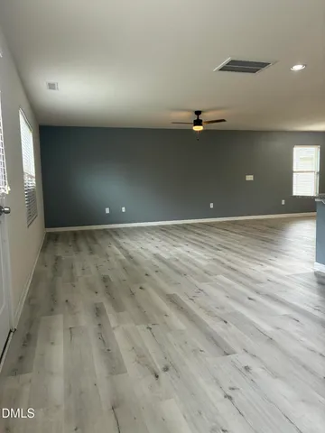 a kitchen with a sink a stove and cabinets
