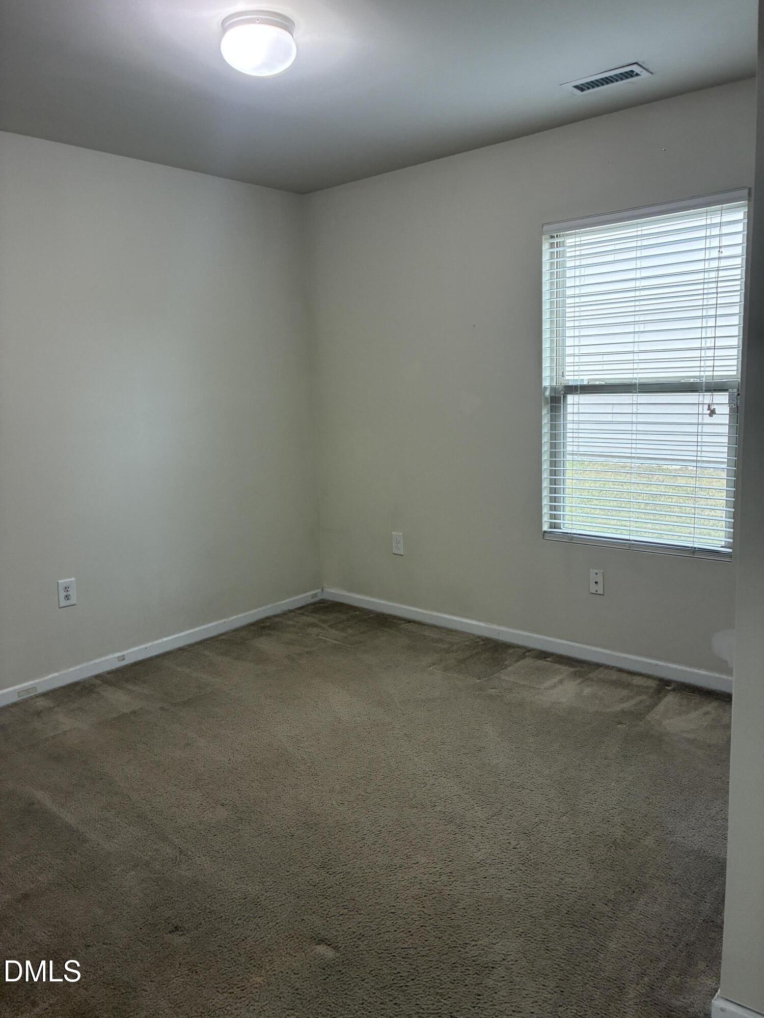 4325 Lyman Avenue Raleigh, NC 27616 - Photo 15 of 52 an empty room with a window