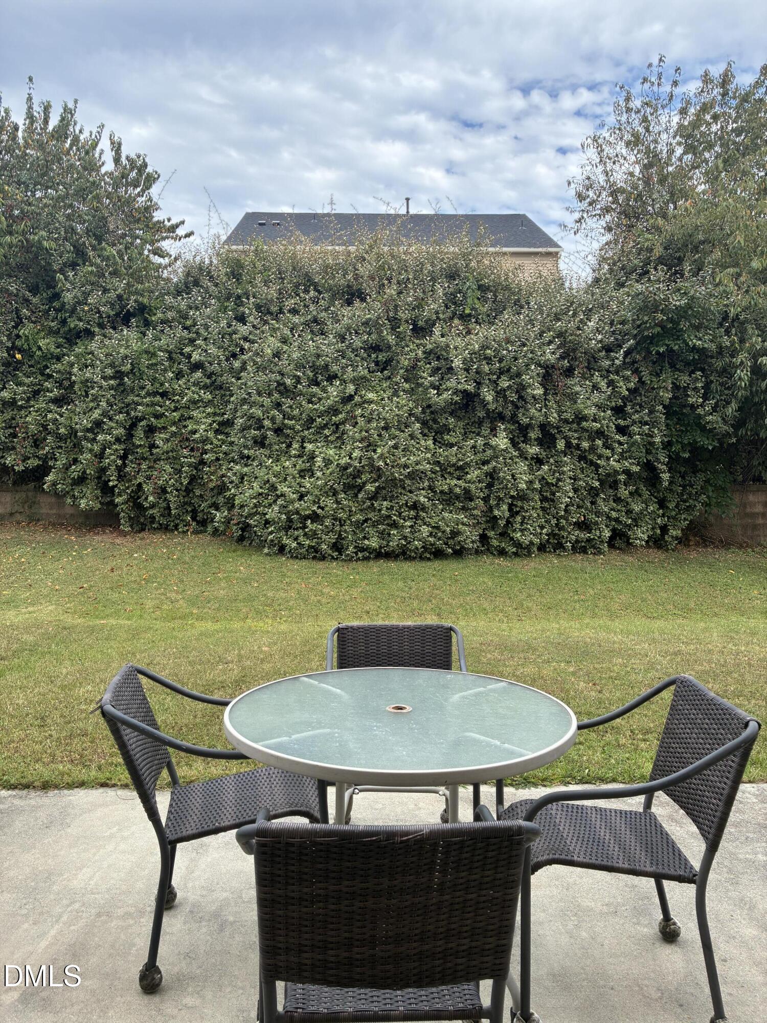 4325 Lyman Avenue Raleigh, NC 27616 - Photo 19 of 52 a view of a chairs and table in the patio