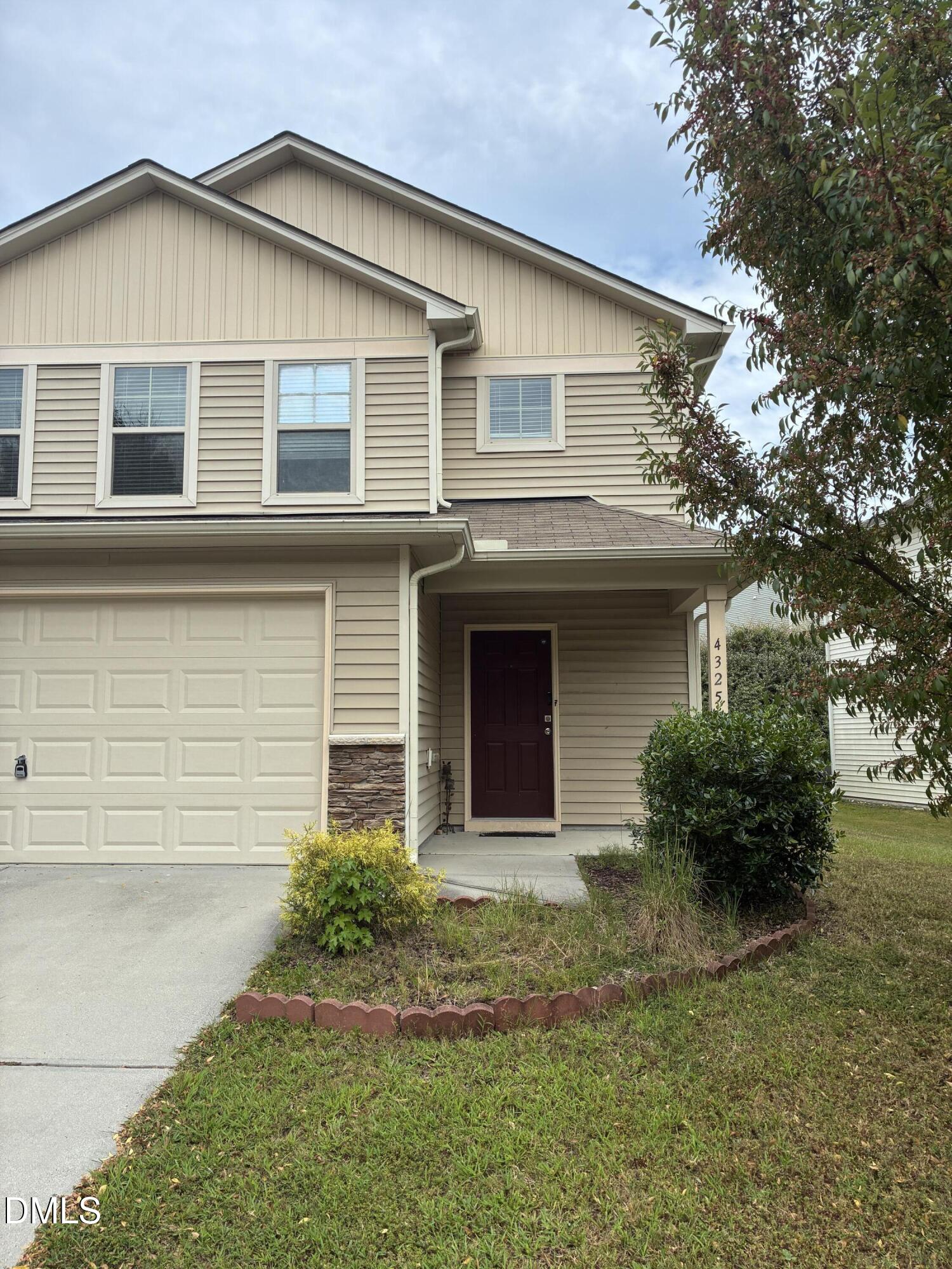 4325 Lyman Avenue Raleigh, NC 27616 - Photo 2 of 52 a front view of a house with garden