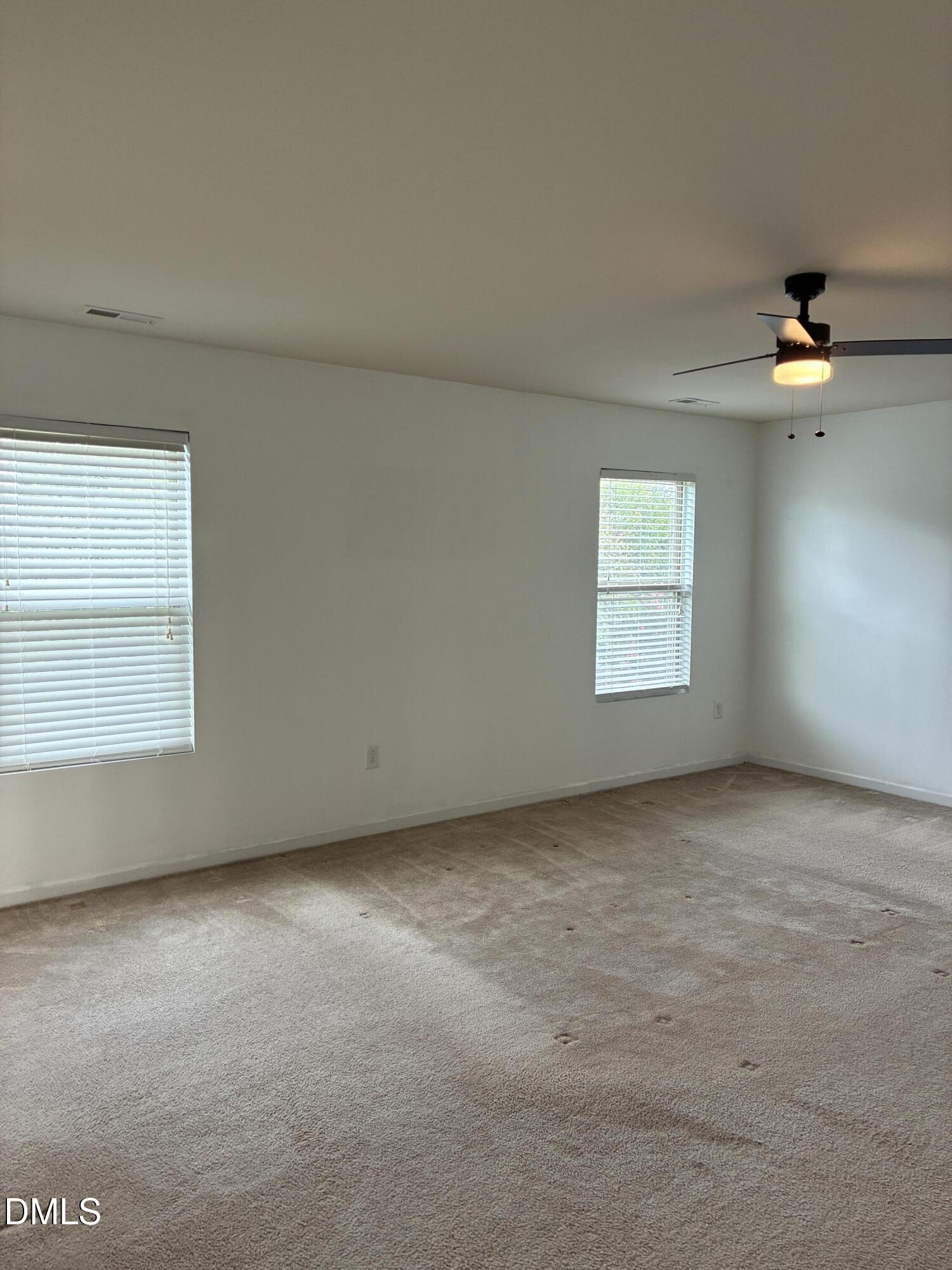 4325 Lyman Avenue Raleigh, NC 27616 - Photo 32 of 52 an empty room with a empty space and windows