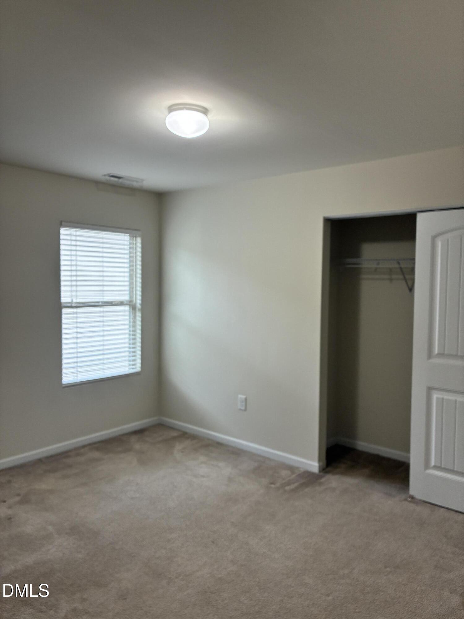 4325 Lyman Avenue Raleigh, NC 27616 - Photo 40 of 52 an empty room with a empty space and windows