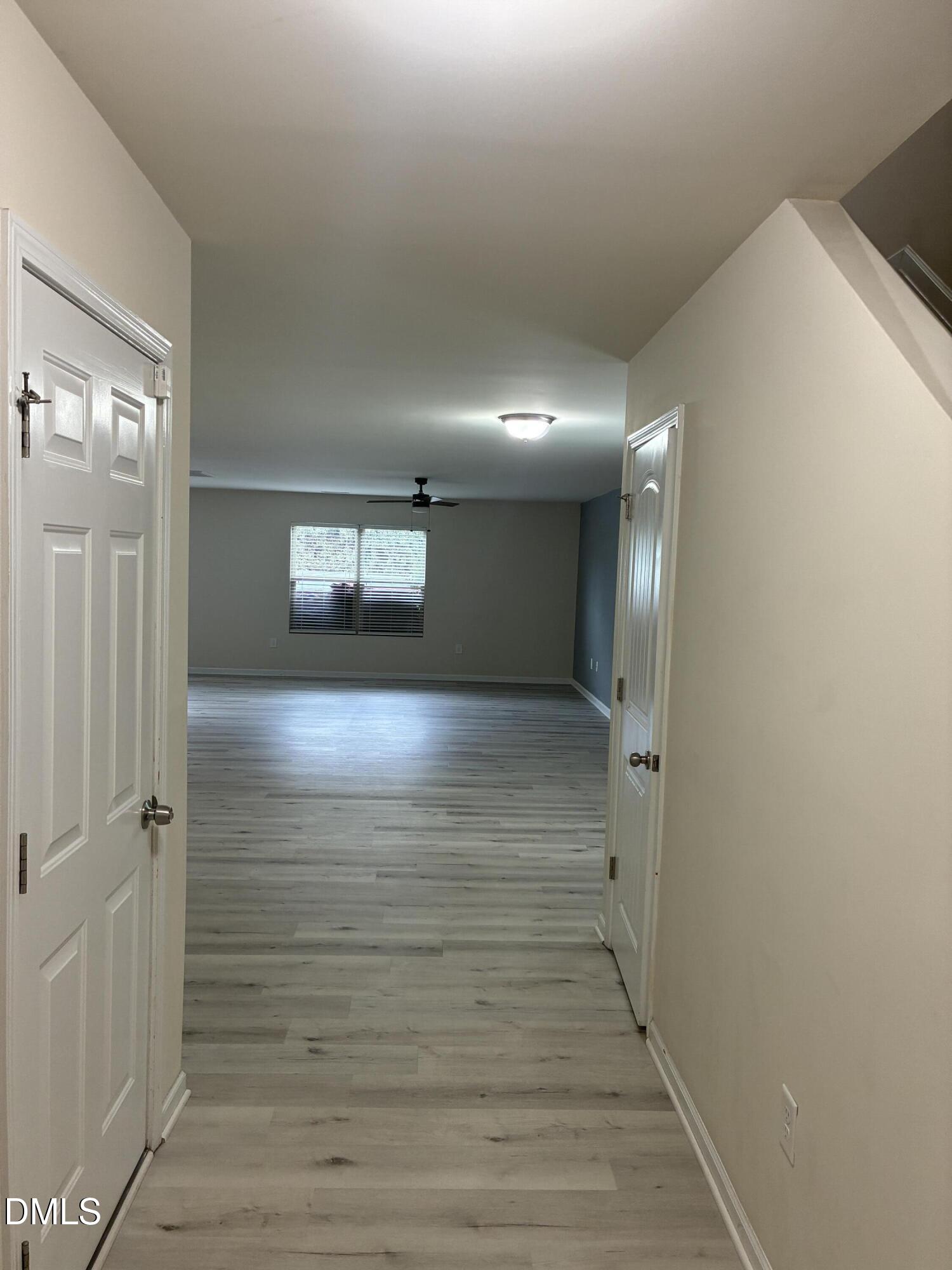 4325 Lyman Avenue Raleigh, NC 27616 - Photo 4 of 52 a view of hallway with wooden floor