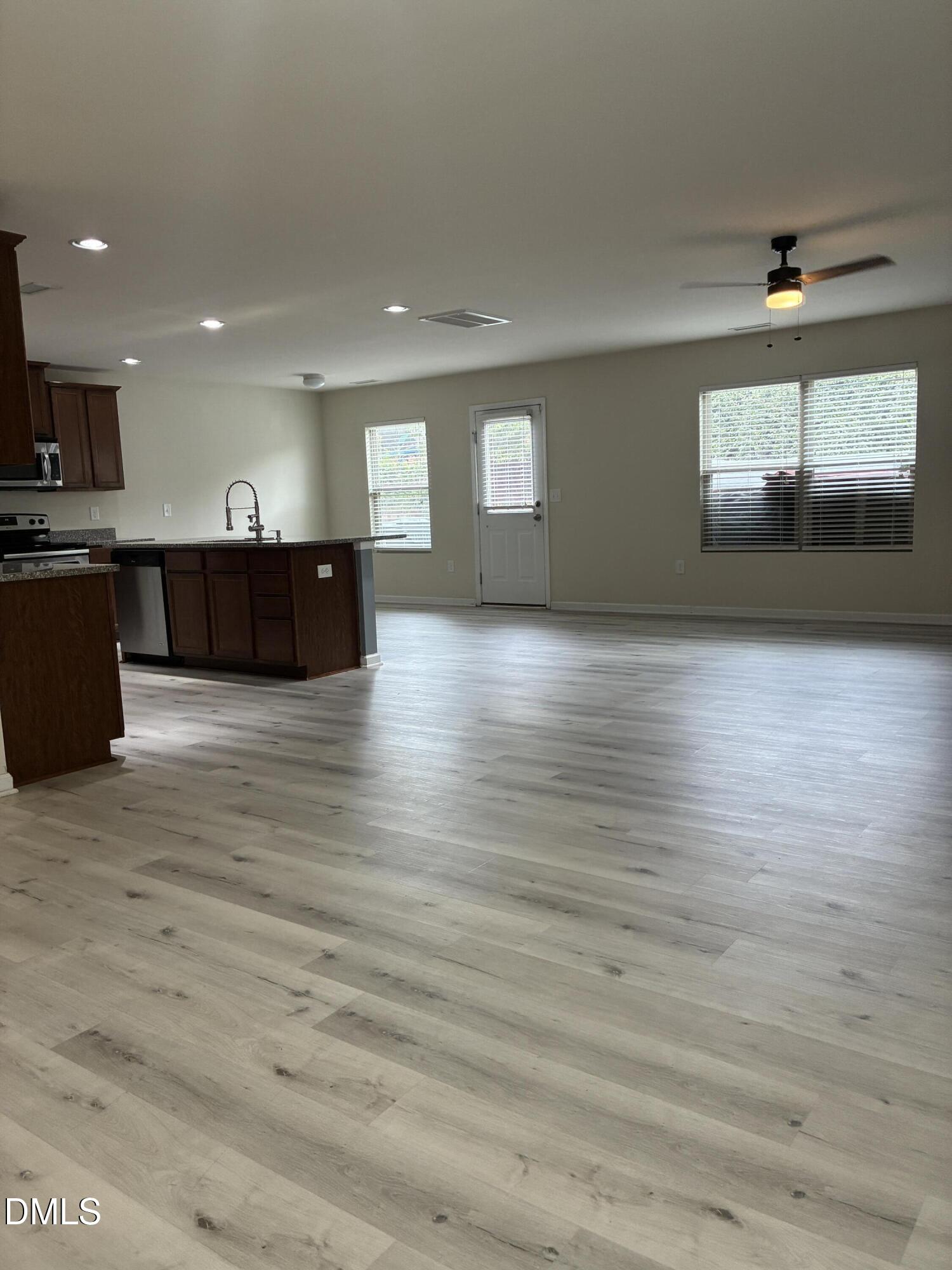 4325 Lyman Avenue Raleigh, NC 27616 - Photo 5 of 52 a view of large hall with wooden floor