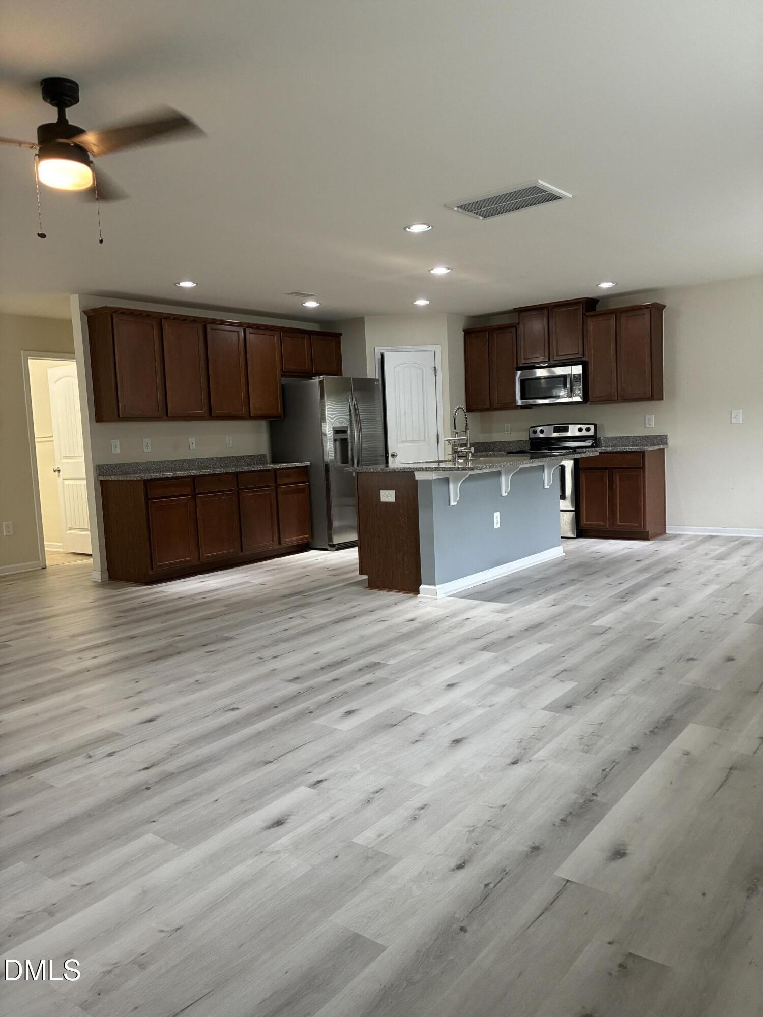 4325 Lyman Avenue Raleigh, NC 27616 - Photo 7 of 52 a view of kitchen with microwave and cabinets
