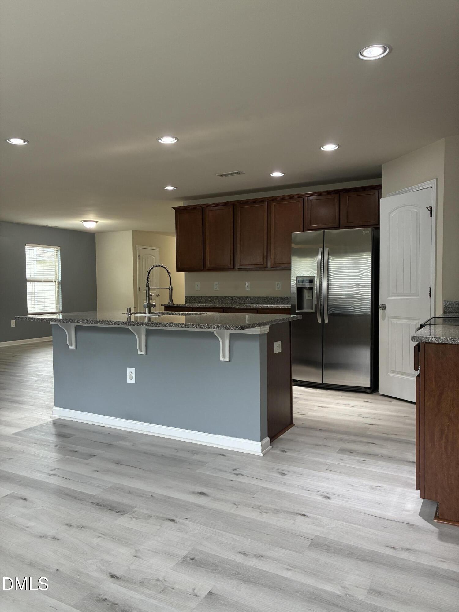 4325 Lyman Avenue Raleigh, NC 27616 - Photo 8 of 52 a view of kitchen with wooden floor