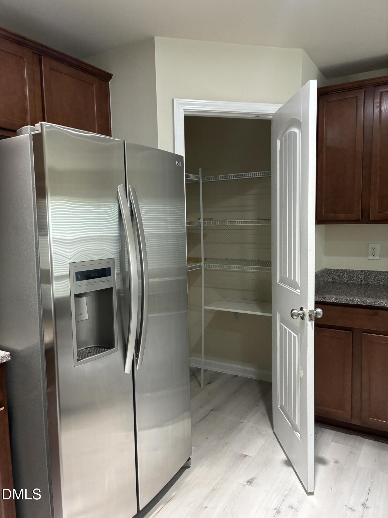4325 Lyman Avenue Raleigh, NC 27616 - Photo 10 of 52 a metallic refrigerator freezer sitting inside of a kitchen
