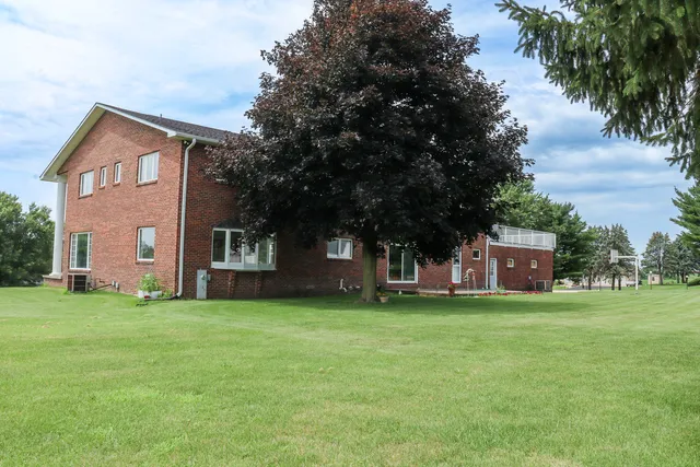 a view of a tree in front of a house