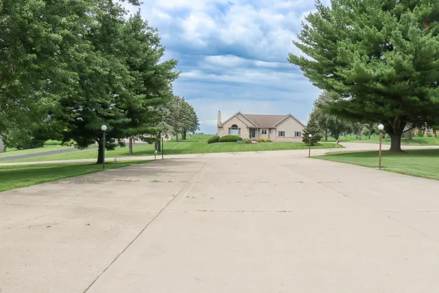 a living room with furniture and a lamp