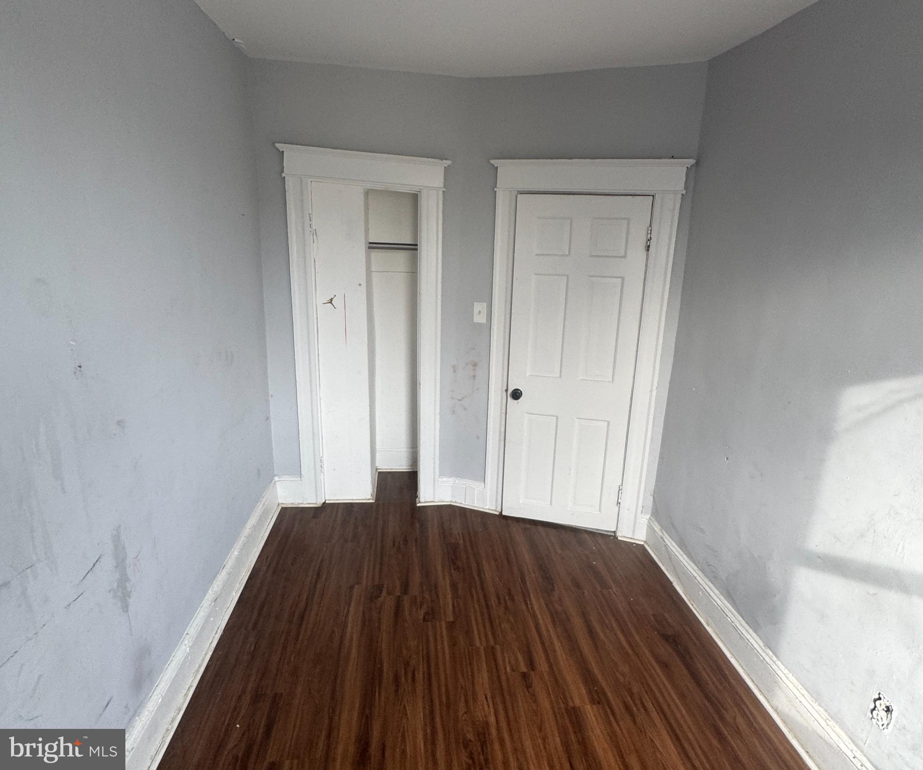 2801 Presbury Street Baltimore, MD 21216 - Photo 13 of 17 a view of a small space with wooden floor and closet