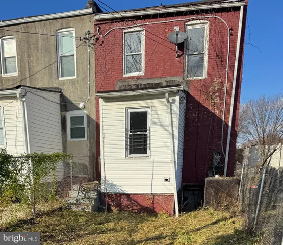 a view of a house with a door and a window