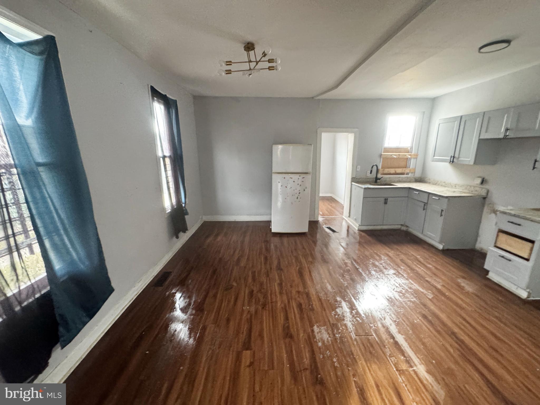 2801 Presbury Street Baltimore, MD 21216 - Photo 7 of 17 a living room with stainless steel appliances wooden floors and view living room