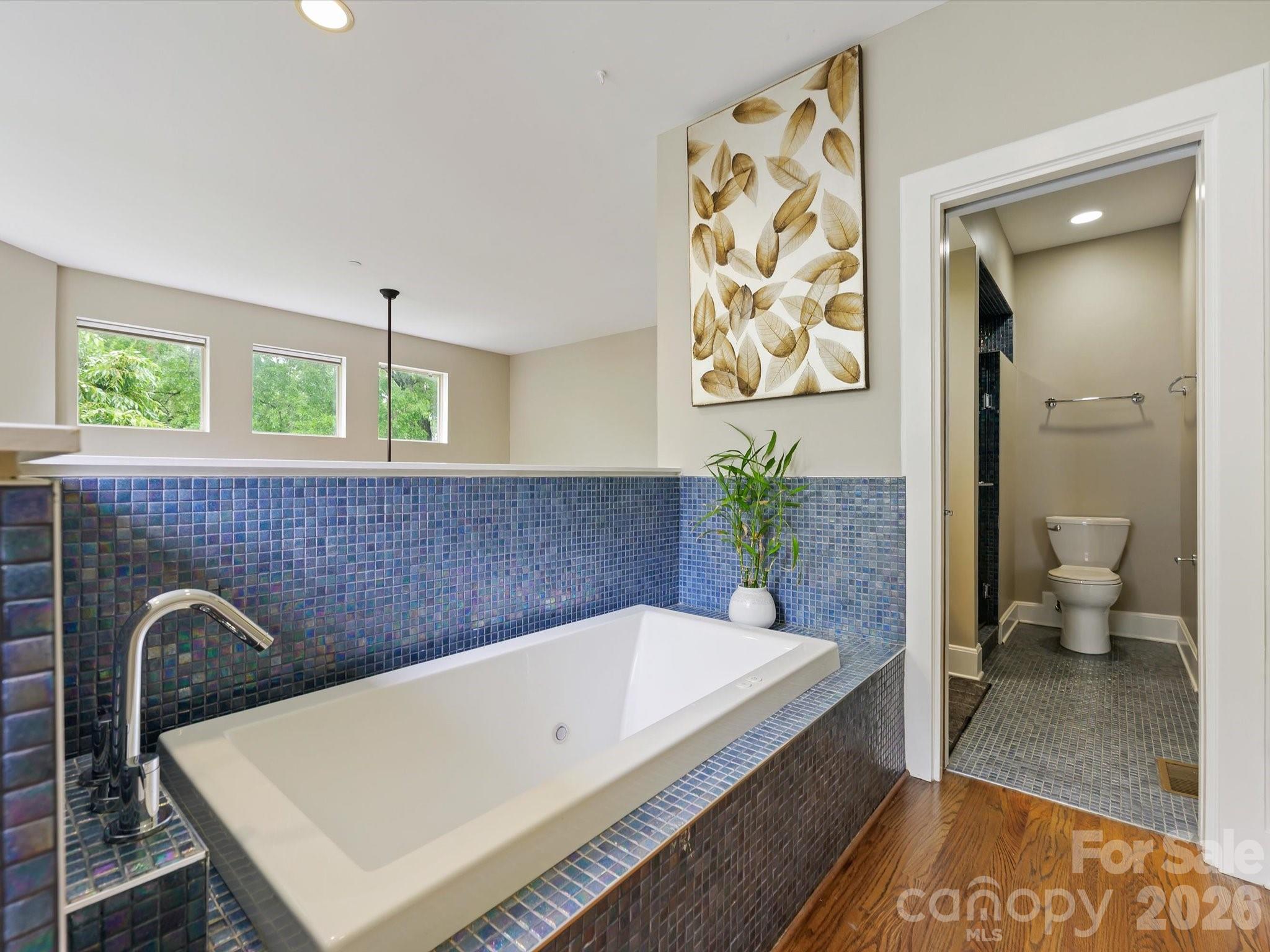420 Queens Road Charlotte, NC 28207 - Photo 32 of 35 a bathroom with a bathtub and a shower