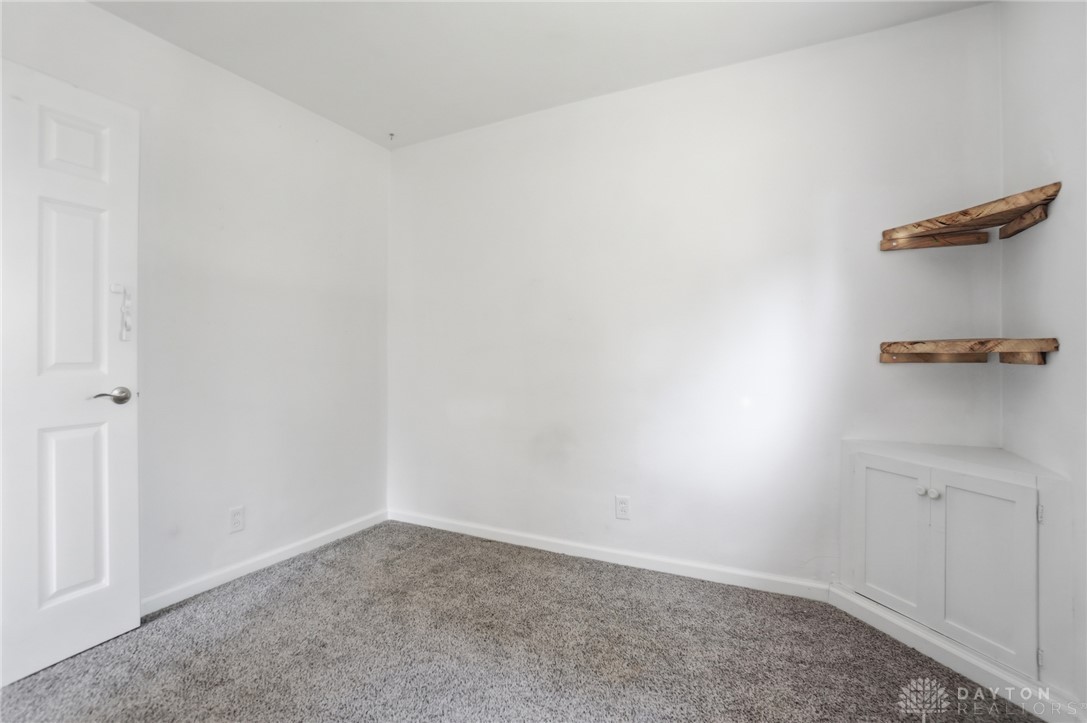 629 Storms Road Dayton, OH 45429 - Photo 34 of 51 This spacious bedroom offers comfortable carpet flooring and ample natural light, ideal for peaceful living.