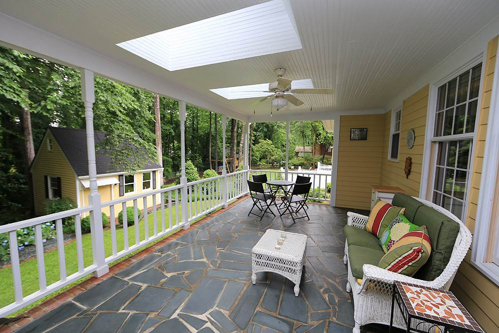 521 Compton Road Raleigh, NC 27609 - Photo 10 of 14 LOVE this porch w/skylights and view of tranquil back yard. Porch