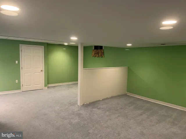 an empty room with kitchen