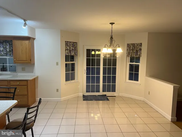 a view of empty room with windows