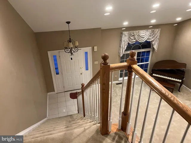 a view of a hallway with stairs