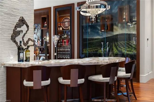 a dining room with furniture and a flat screen tv