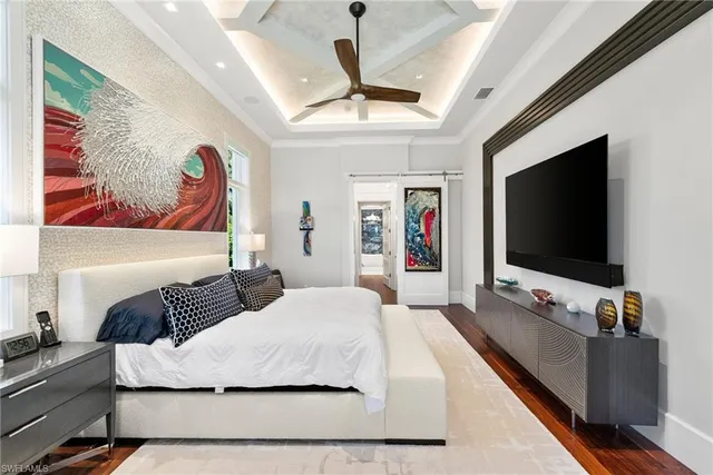 a spacious bathroom with a sink a large mirror and a toilet