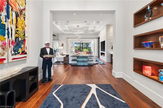 a living room with fireplace furniture and a flat screen tv