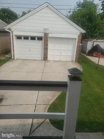 a view of a room with wooden floor and windows