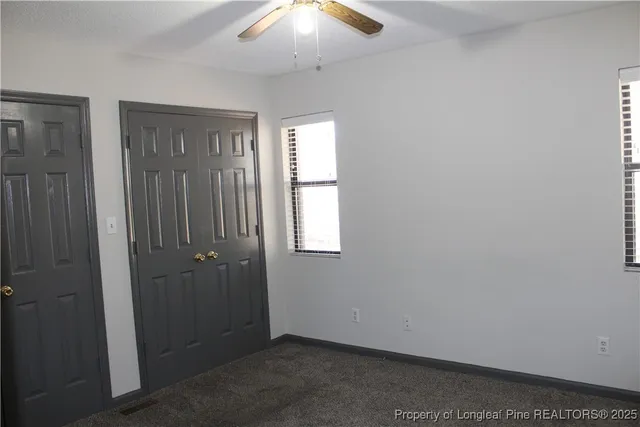 an empty room with closet area