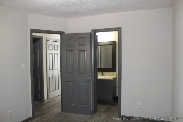 a view of a hallway with closet area