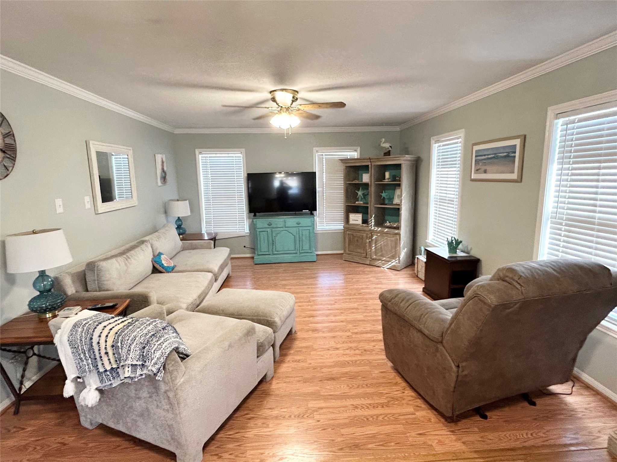 151 Neptune Sargent, TX 77414 - Photo 4 of 26 a living room with furniture and a flat screen tv