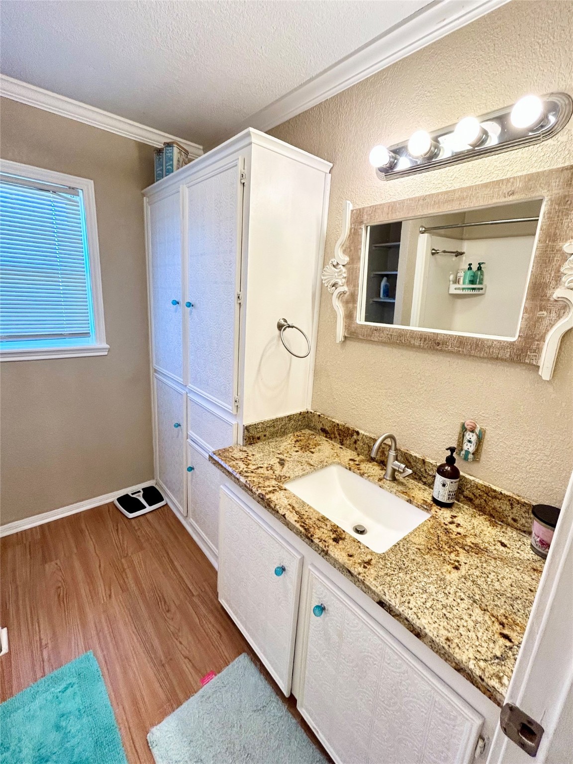 151 Neptune Sargent, TX 77414 - Photo 8 of 26 a bathroom with a sink and a mirror