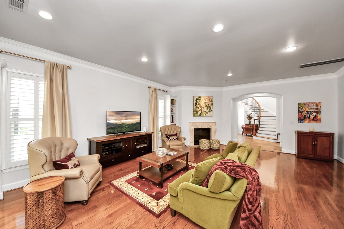6302 Hermann Lake Drive Houston, TX 77021 - Photo 12 of 50 a living room with furniture flat screen tv and wooden floor