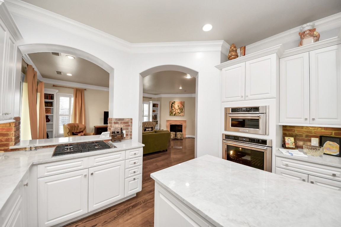 6302 Hermann Lake Drive Houston, TX 77021 - Photo 20 of 50 a large white kitchen with stainless steel appliances