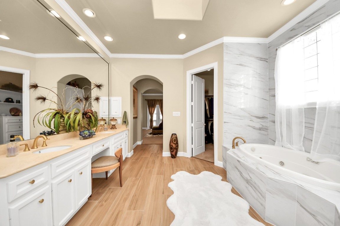 6302 Hermann Lake Drive Houston, TX 77021 - Photo 30 of 50 a large spacious bathroom with a double vanity sink a mirror and a bathtub