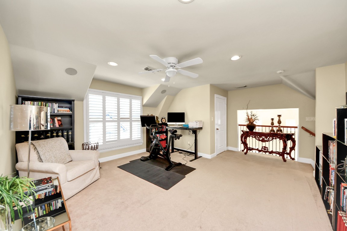 6302 Hermann Lake Drive Houston, TX 77021 - Photo 39 of 50 a living room with furniture a window and a flat screen tv