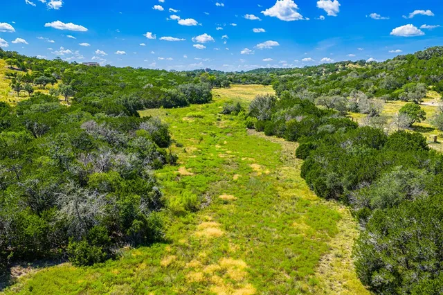 a view of a lake with a big yard