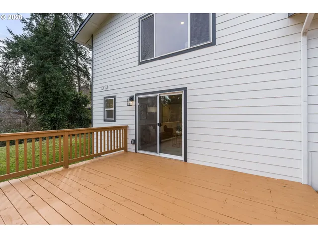 a view of a balcony with wooden floor