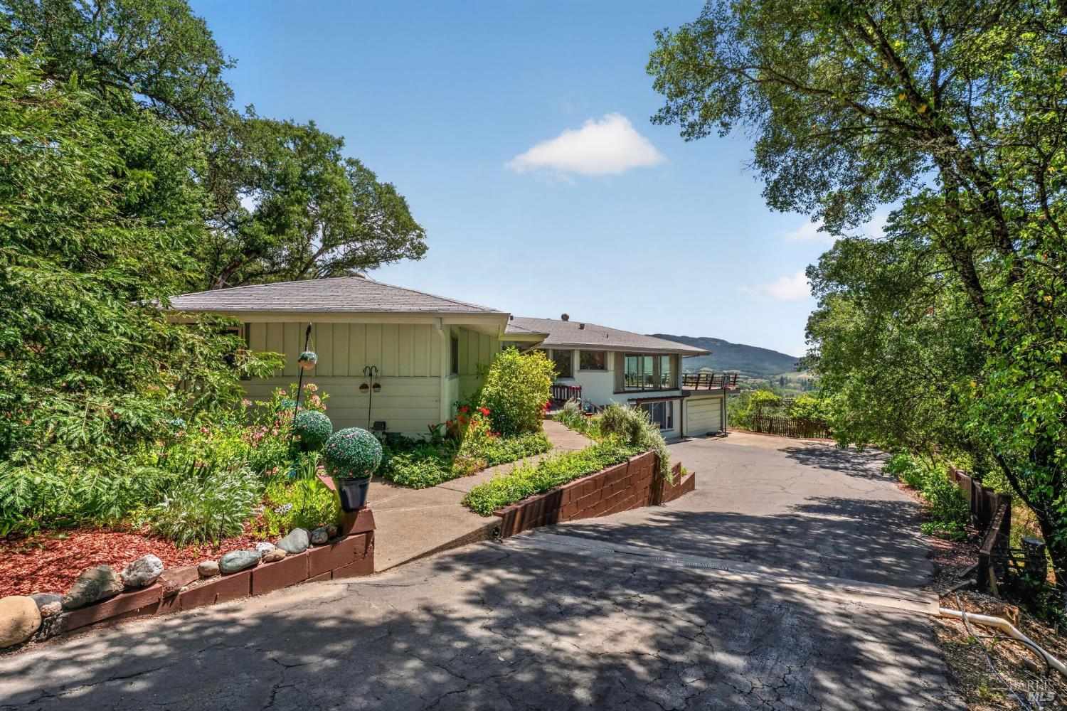 891 Isola Way Ukiah, CA 95482 - Photo 18 of 46 a view of a house with garden and plants