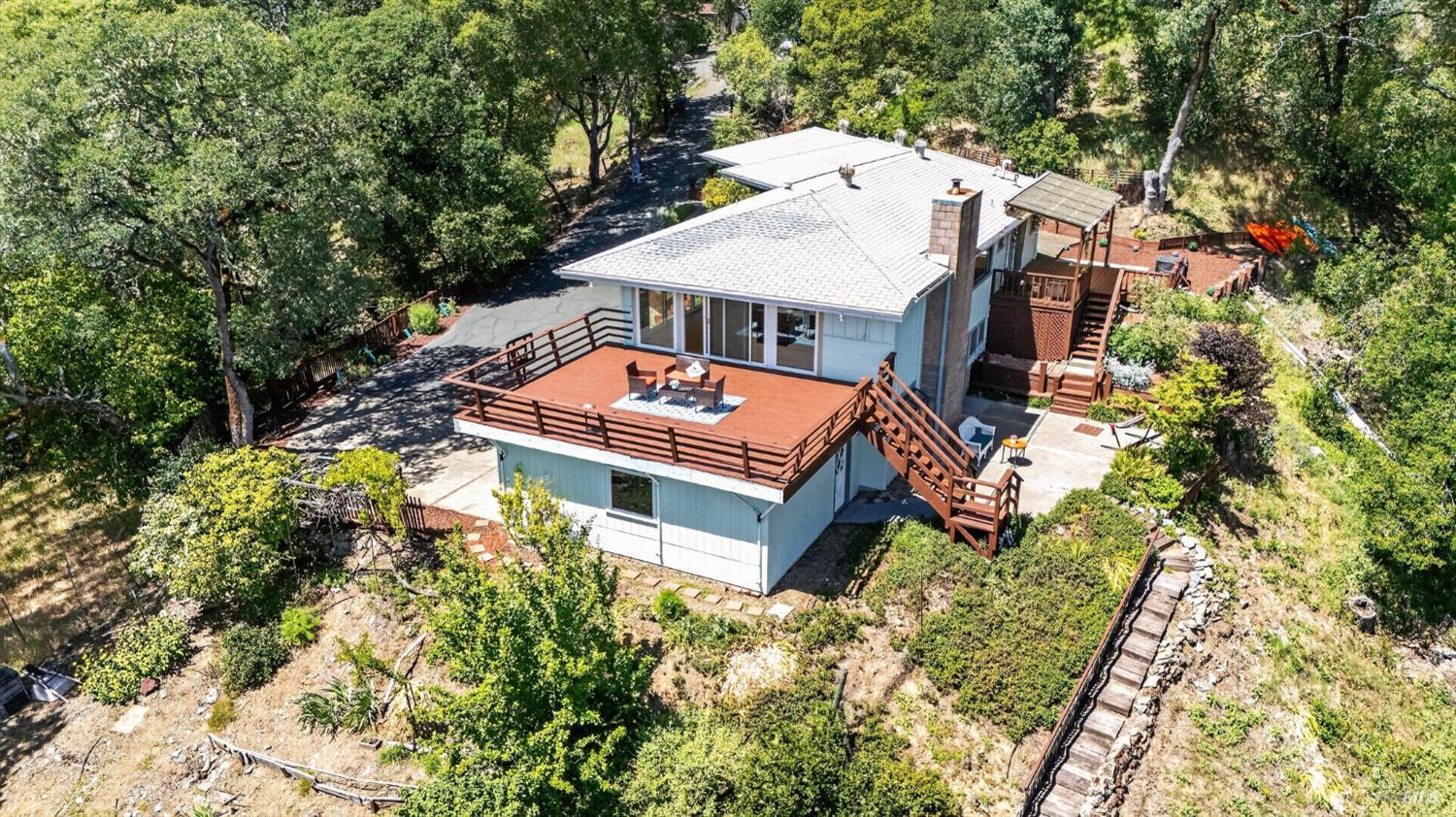 891 Isola Way Ukiah, CA 95482 - Photo 22 of 46 an aerial view of a house with a yard and large trees