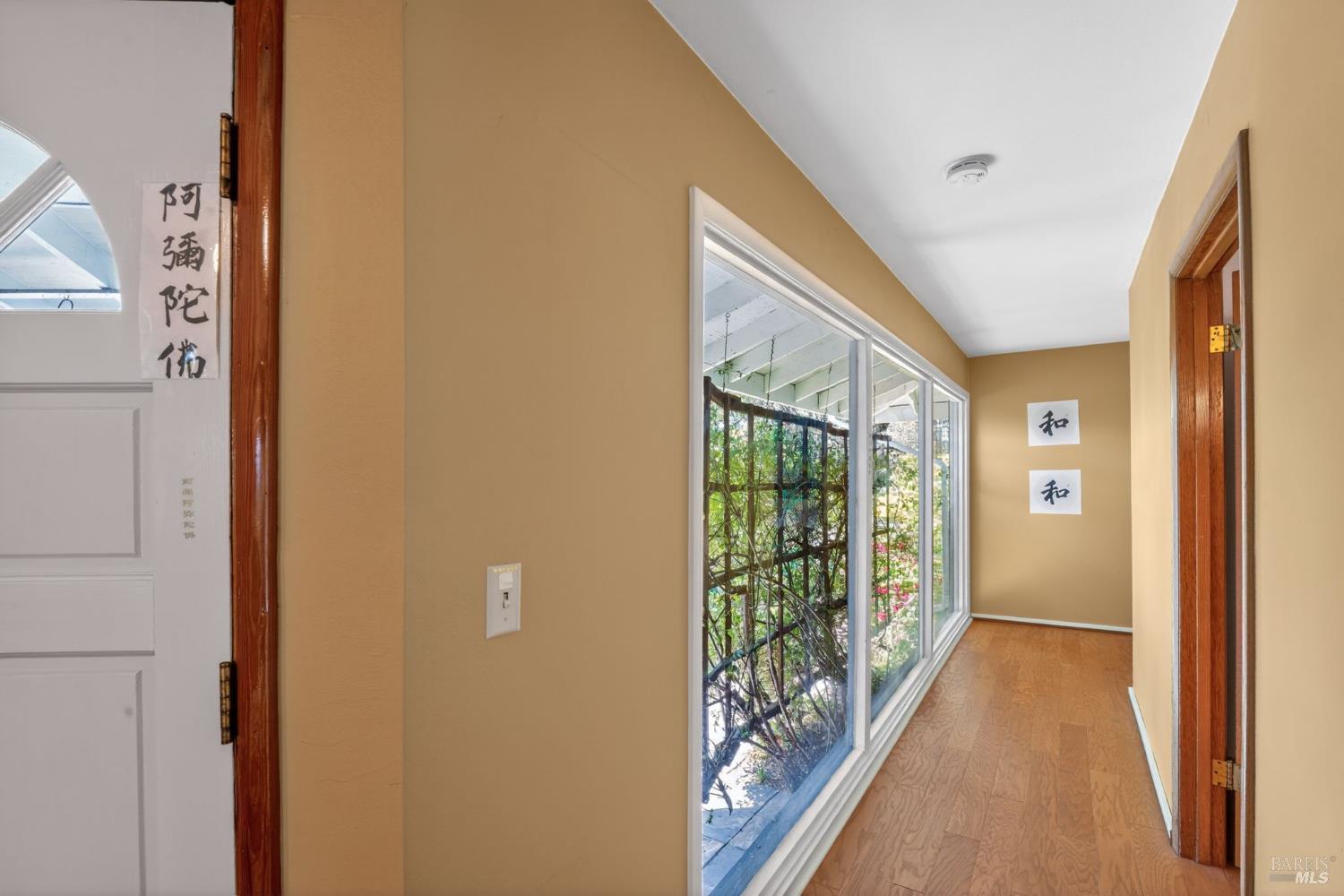 891 Isola Way Ukiah, CA 95482 - Photo 32 of 46 a view of hallway with wooden floor and windows