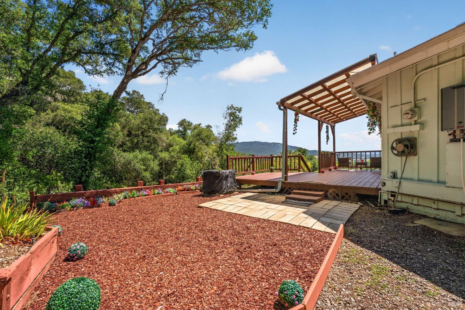 891 Isola Way Ukiah, CA 95482 - Photo 4 of 46 a view of a backyard with sitting area