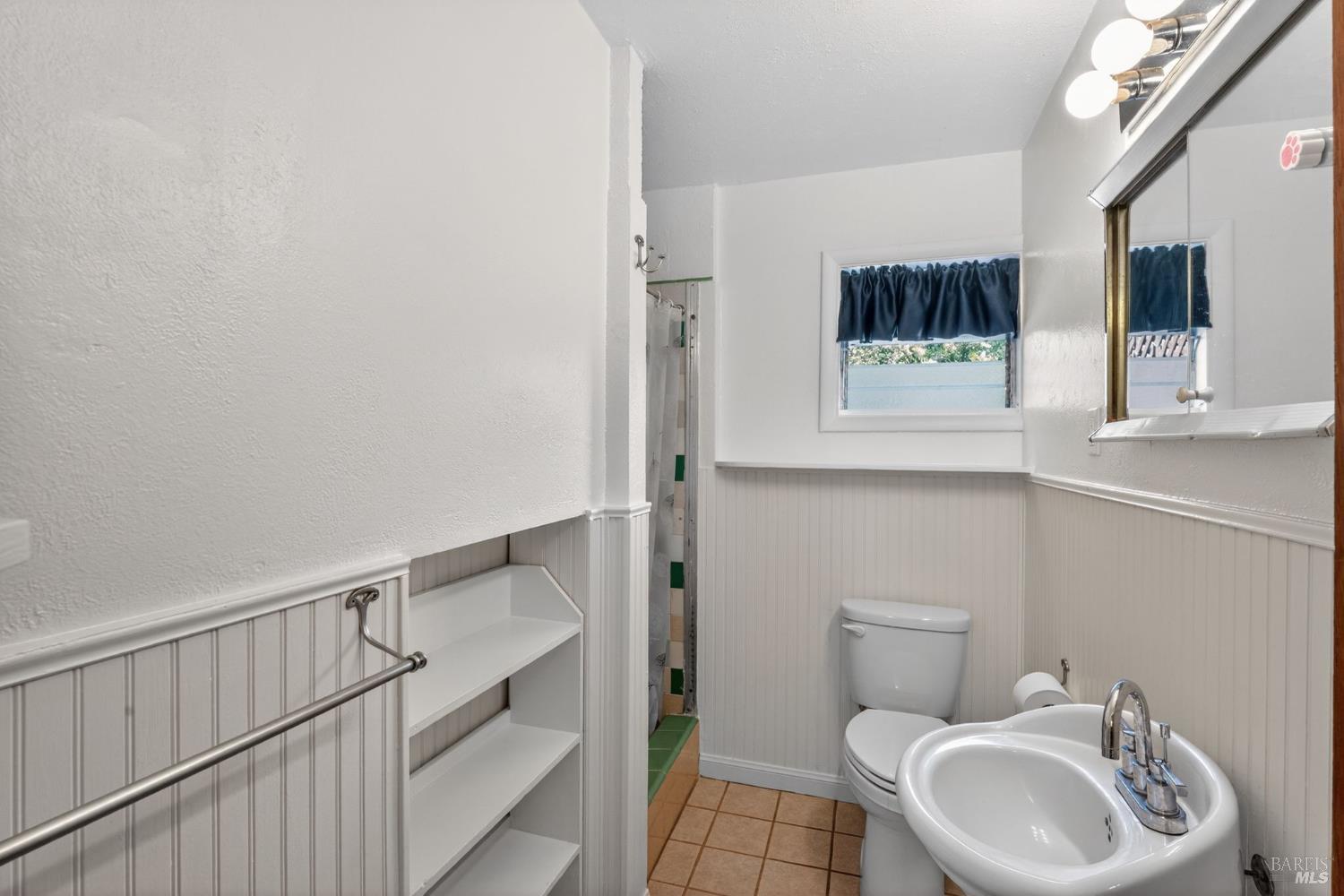 891 Isola Way Ukiah, CA 95482 - Photo 43 of 46 a bathroom with a toilet sink and mirror