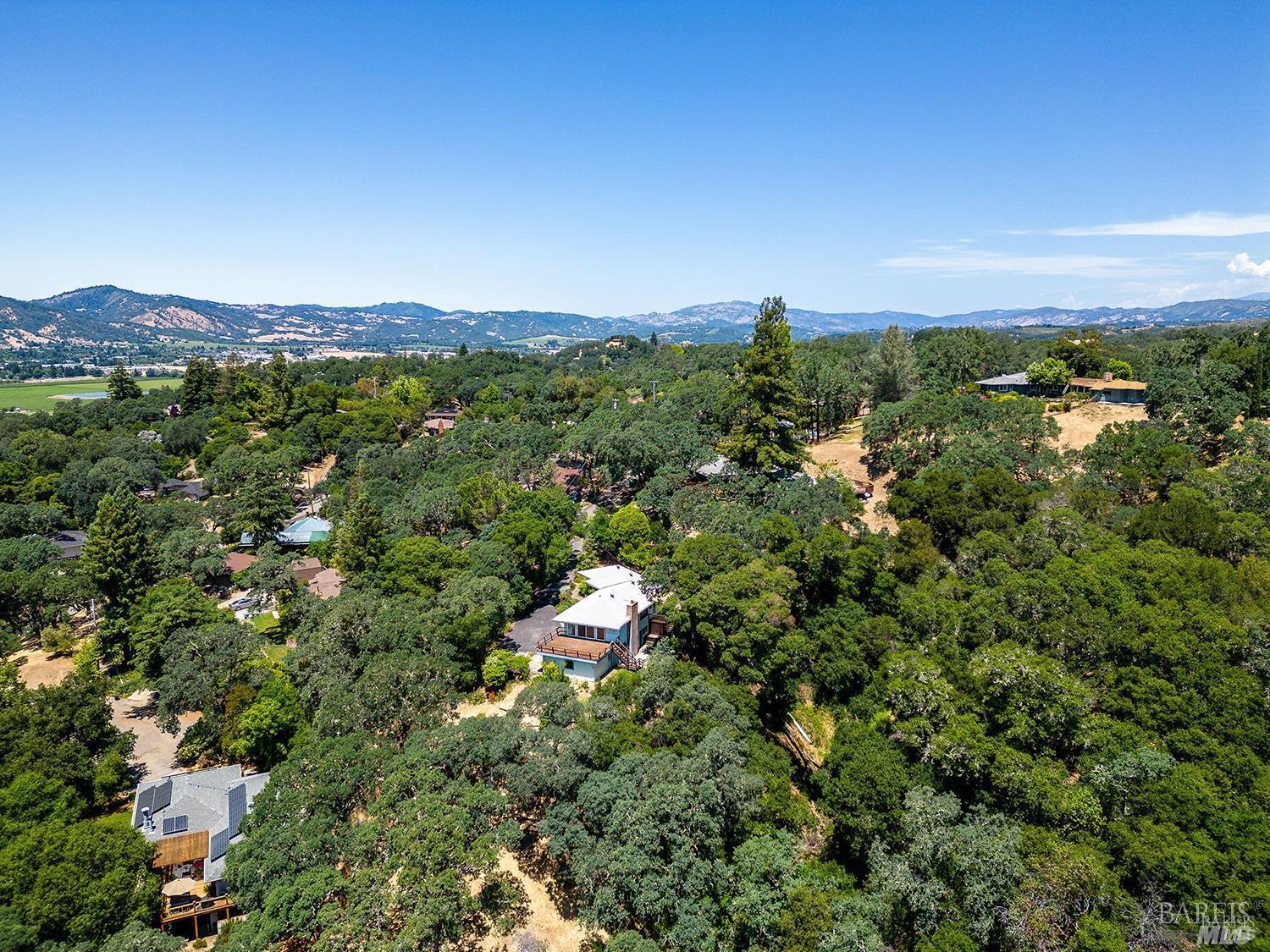 891 Isola Way Ukiah, CA 95482 - Photo 45 of 46 a view of a city with lush green forest