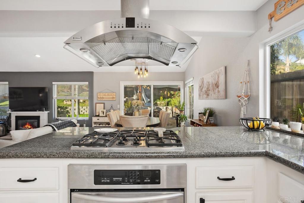 2804 Jacaranda Avenue Carlsbad, CA 92009 - Photo 16 of 36 a kitchen with stainless steel appliances granite countertop a sink and a counter space