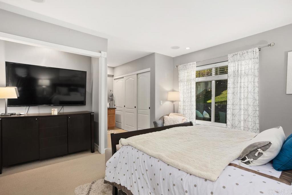 2804 Jacaranda Avenue Carlsbad, CA 92009 - Photo 19 of 36 a bedroom with a bed and a flat screen tv